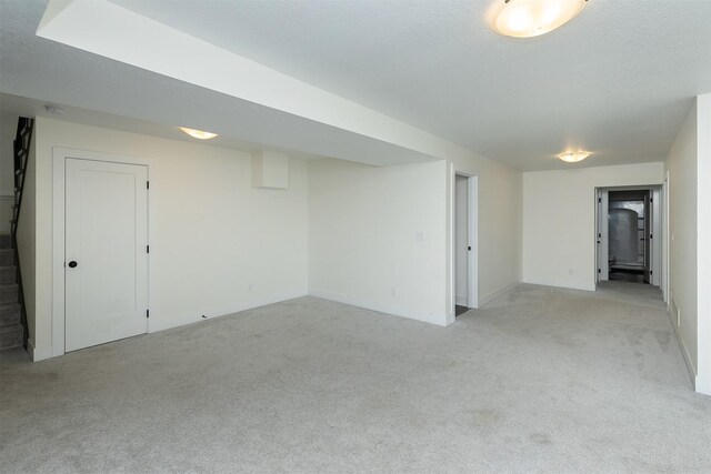 309 NW Beechwood Dr, Grimes, IA 50111 - unfurnished room with light carpet and stairs