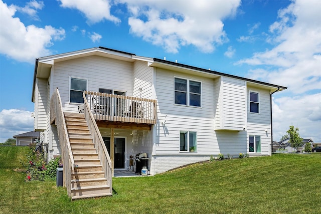 309 NW Beechwood Dr, Grimes, IA 50111 - back of property with stairway, a lawn, and a deck
