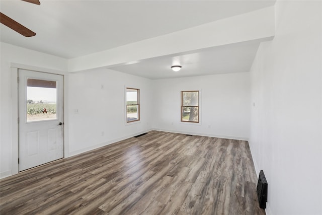 7404 Sioux Ave, Reasnor, IA 50232 - empty room featuring wood finished floors and a ceiling fan