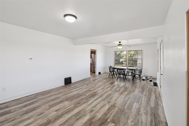 7404 Sioux Ave, Reasnor, IA 50232 - dining area with wood finished floors and ceiling fan