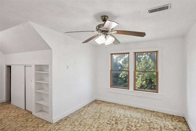 7404 Sioux Ave, Reasnor, IA 50232 - unfurnished bedroom with carpet floors, a closet, and a ceiling fan