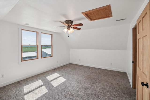 7404 Sioux Ave, Reasnor, IA 50232 - bonus room featuring ceiling fan, carpet flooring, and lofted ceiling