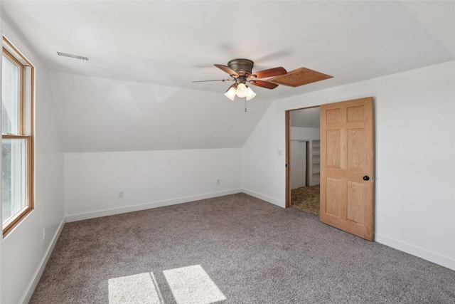 7404 Sioux Ave, Reasnor, IA 50232 - additional living space with carpet flooring, plenty of natural light, ceiling fan, and lofted ceiling