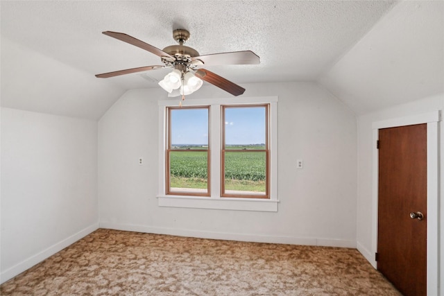 7404 Sioux Ave, Reasnor, IA 50232 - additional living space with lofted ceiling, carpet, and a ceiling fan
