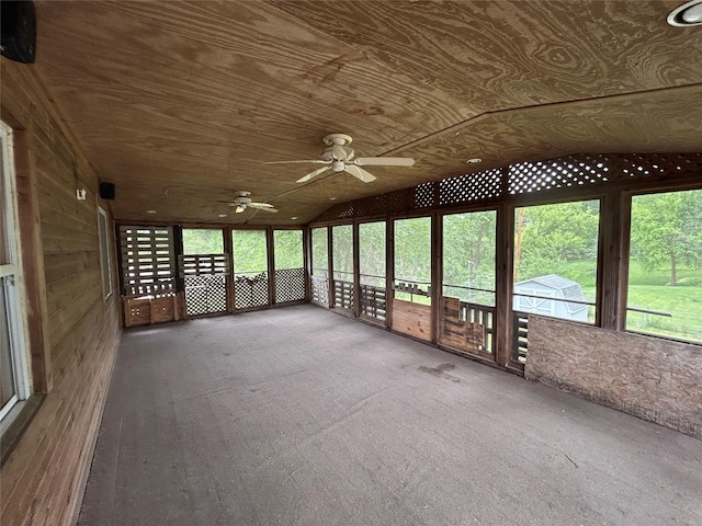 7116 Maple Dr, Urbandale, IA 50322 - unfurnished sunroom featuring lofted ceiling and ceiling fan