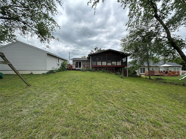 7116 Maple Dr, Urbandale, IA 50322 - view of green lawn featuring a sunroom
