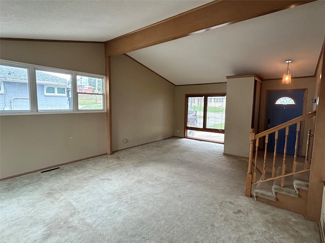 7116 Maple Dr, Urbandale, IA 50322 - unfurnished living room featuring carpet floors, stairway, and a textured ceiling