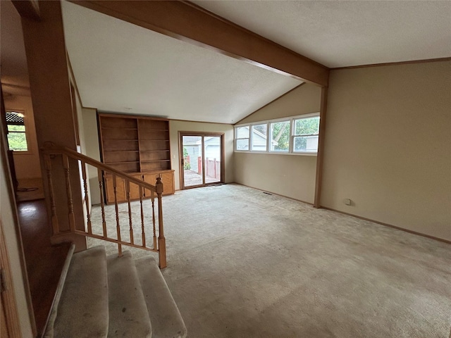 7116 Maple Dr, Urbandale, IA 50322 - empty room featuring carpet floors, stairway, and built in features