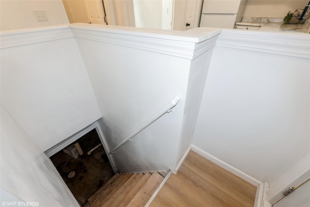 1547 13th St, Des Moines, IA 50314 - staircase with wood finished floors and baseboards