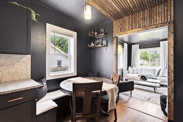 1315 Bundy St, Des Moines, IA 50315 - dining area with wood finished floors and a textured wall