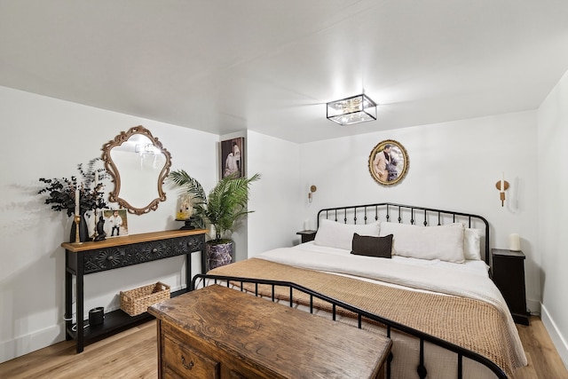 1315 Bundy St, Des Moines, IA 50315 - bedroom with light wood-style flooring and baseboards