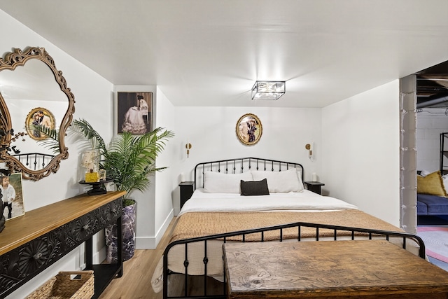 1315 Bundy St, Des Moines, IA 50315 - bedroom with light wood-style flooring and baseboards