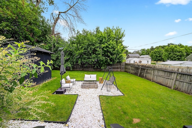 1315 Bundy St, Des Moines, IA 50315 - fenced backyard featuring a patio and an outdoor living space