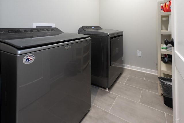 807 W Orchard Ave, Indianola, IA 50125 - washroom with independent washer and dryer and light tile patterned flooring