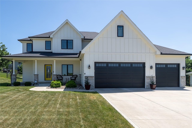807 W Orchard Ave, Indianola, IA 50125 - modern farmhouse style home with board and batten siding, concrete driveway, a front yard, stone siding, and a shingled roof