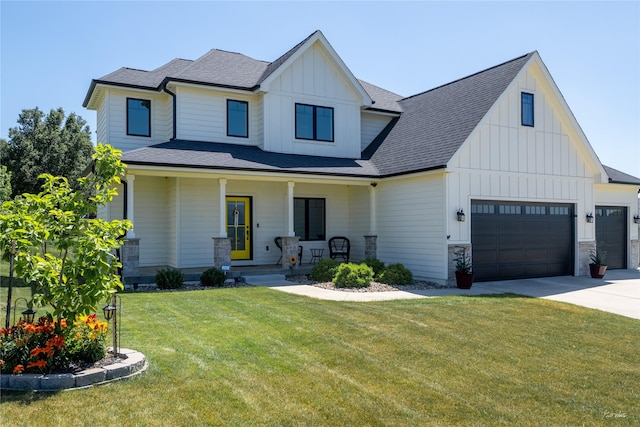807 W Orchard Ave, Indianola, IA 50125 - modern inspired farmhouse with board and batten siding, a porch, a front lawn, concrete driveway, and a shingled roof