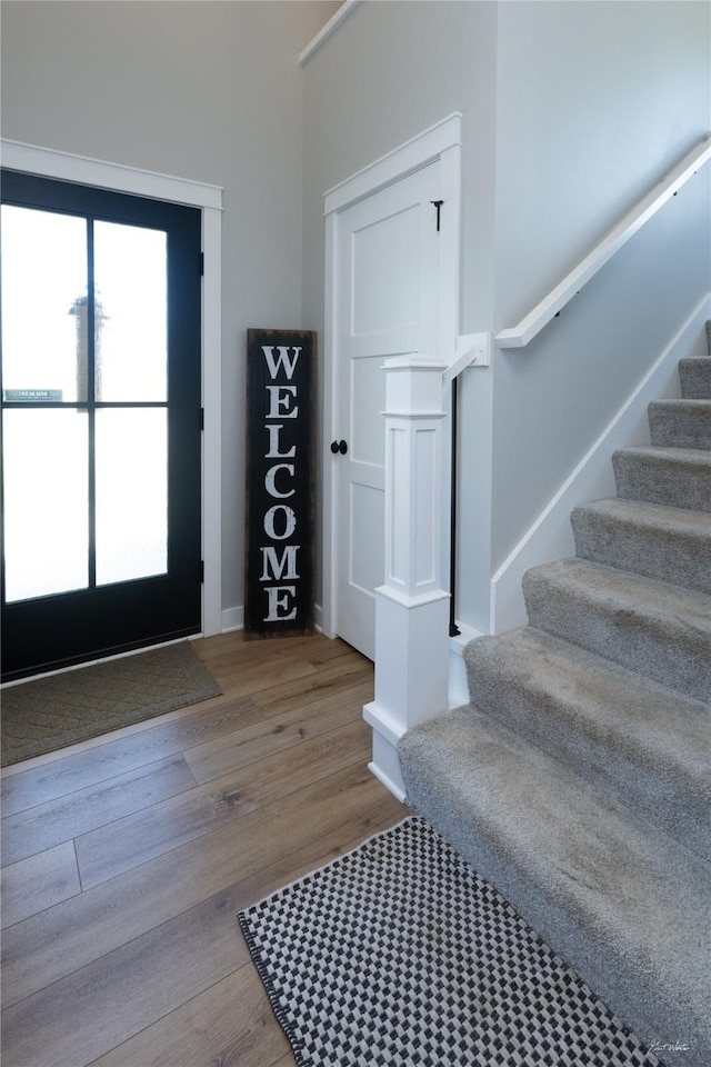 807 W Orchard Ave, Indianola, IA 50125 - entrance foyer featuring stairs and wood finished floors