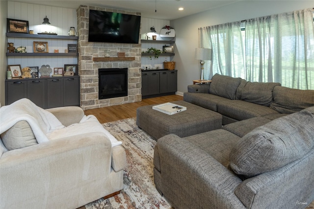 807 W Orchard Ave, Indianola, IA 50125 - living area with wood finished floors, a fireplace, and recessed lighting