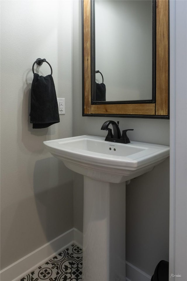807 W Orchard Ave, Indianola, IA 50125 - bathroom with baseboards and tile patterned flooring