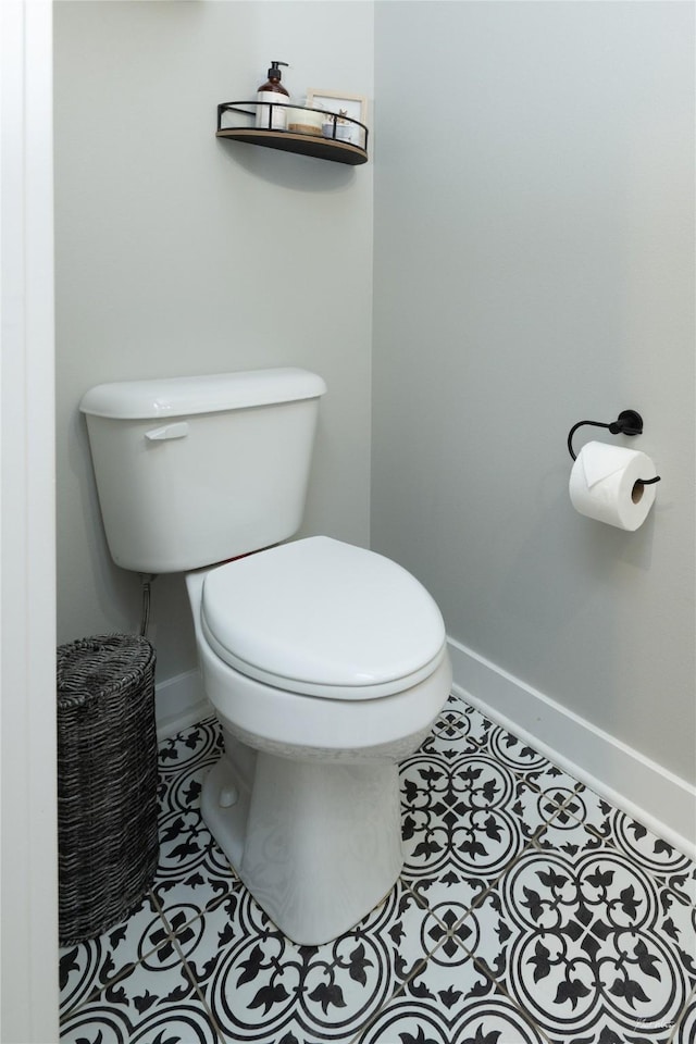 807 W Orchard Ave, Indianola, IA 50125 - half bathroom featuring toilet and tile patterned flooring