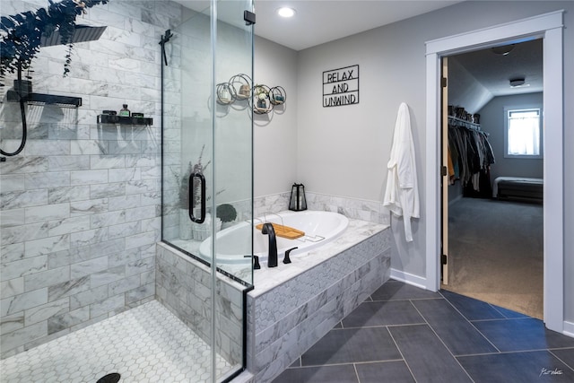 807 W Orchard Ave, Indianola, IA 50125 - full bath with a stall shower, a garden tub, tile patterned flooring, and a spacious closet
