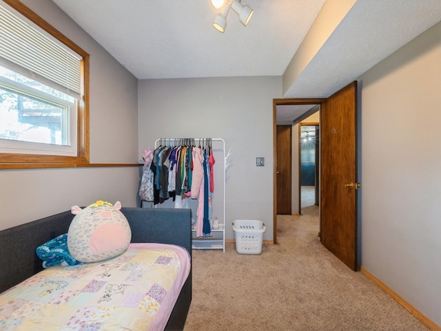 808 SW 2nd St, Stuart, IA 50250 - carpeted bedroom featuring baseboards