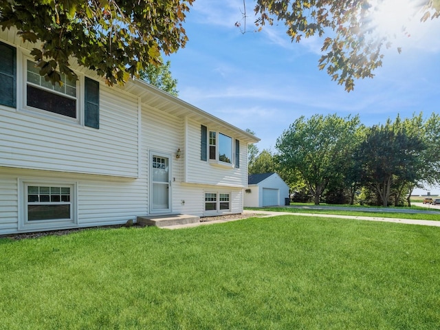 808 SW 2nd St, Stuart, IA 50250 - view of front facade with a garage and a front lawn