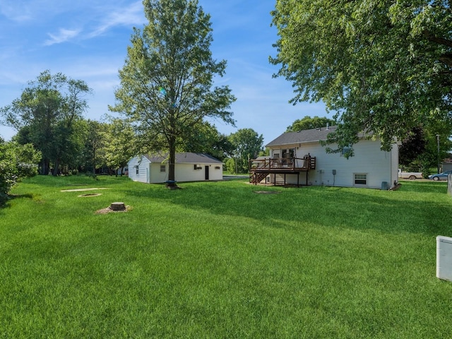 808 SW 2nd St, Stuart, IA 50250 - view of grassy yard with a wooden deck and stairway