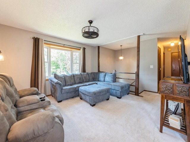 808 SW 2nd St, Stuart, IA 50250 - living area with a textured ceiling and light colored carpet