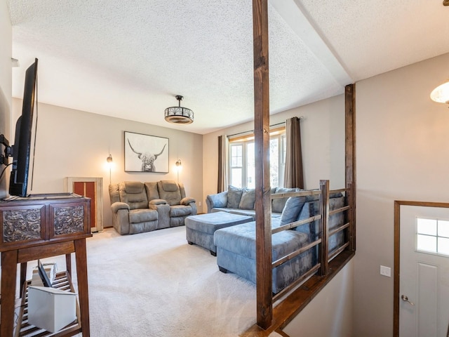 808 SW 2nd St, Stuart, IA 50250 - carpeted living room with plenty of natural light and a textured ceiling