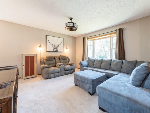 808 SW 2nd St, Stuart, IA 50250 - living area featuring light carpet and a textured ceiling