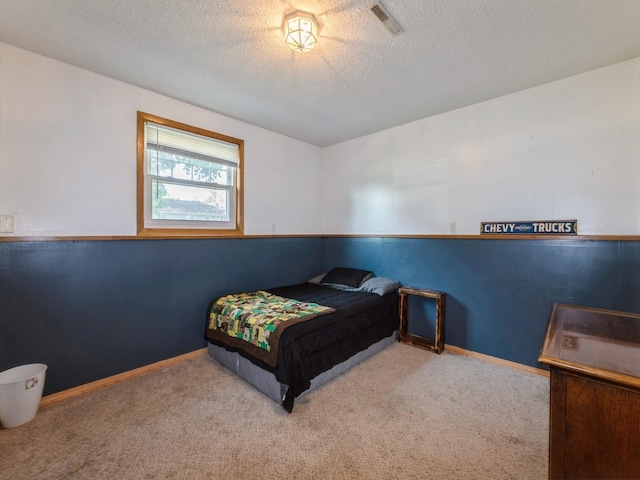 808 SW 2nd St, Stuart, IA 50250 - bedroom featuring carpet floors and a textured ceiling