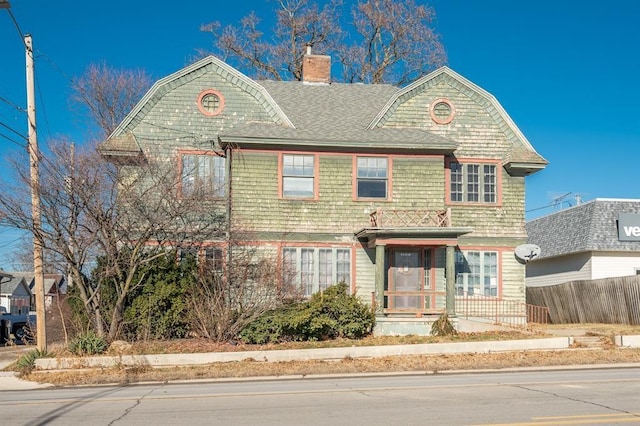115 W Mclane St, Osceola, IA 50213 - view of front facade featuring a chimney and roof with shingles