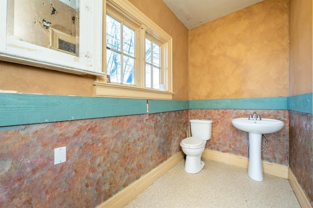 115 W Mclane St, Osceola, IA 50213 - bathroom featuring toilet and baseboards