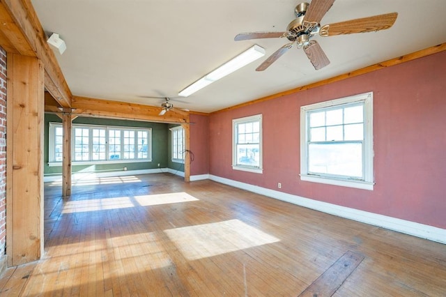 115 W Mclane St, Osceola, IA 50213 - empty room with hardwood / wood-style flooring, plenty of natural light, and ceiling fan