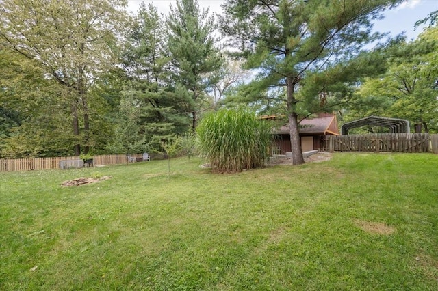 407 E Mckinney St, Runnells, IA 50237 - fenced backyard with a detached carport