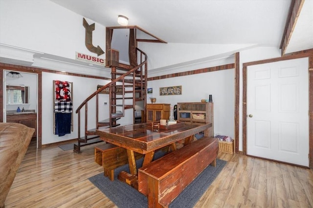 407 E Mckinney St, Runnells, IA 50237 - dining area featuring lofted ceiling, stairway, and light wood-style flooring