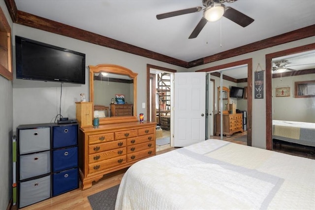407 E Mckinney St, Runnells, IA 50237 - bedroom featuring light wood-type flooring, multiple closets, and a ceiling fan