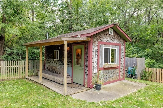 407 E Mckinney St, Runnells, IA 50237 - view of outbuilding featuring a fenced backyard and view of wooded area