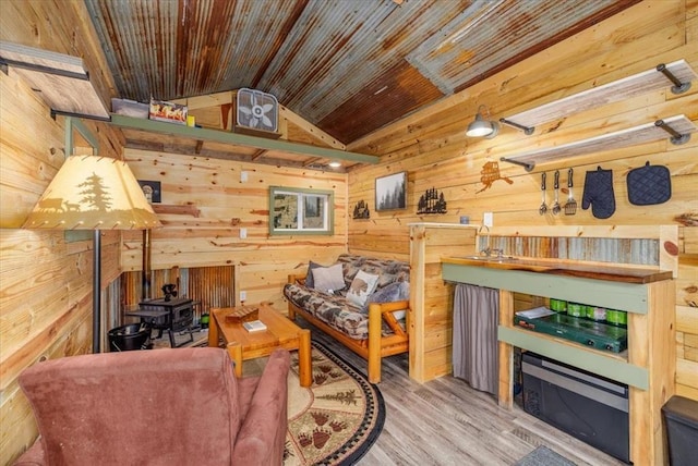 407 E Mckinney St, Runnells, IA 50237 - living area with wooden walls, wood ceiling, vaulted ceiling, and wood finished floors