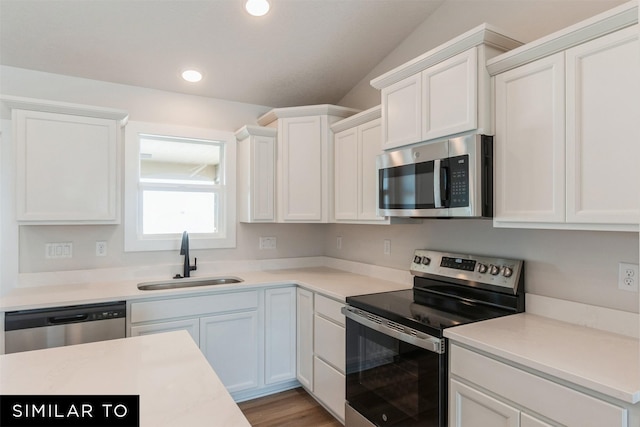 826 31st Ct SW, Altoona, IA 50009 - kitchen featuring stainless steel appliances, white cabinets, light countertops, recessed lighting, and wood finished floors