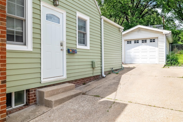 1209 Edgemont St, Des Moines, IA 50315 - doorway to property featuring driveway and a garage