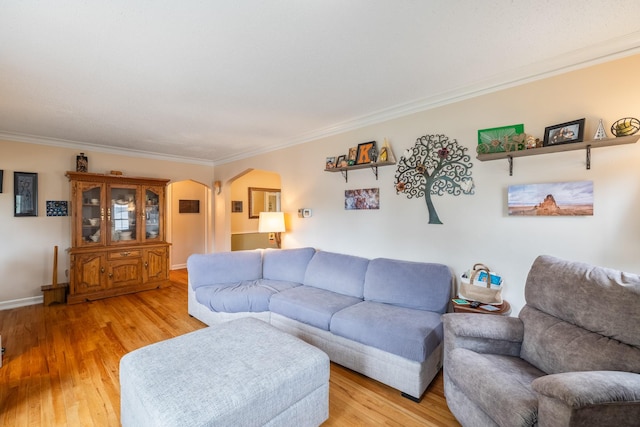 1209 Edgemont St, Des Moines, IA 50315 - living room with arched walkways, crown molding, and light wood-style flooring