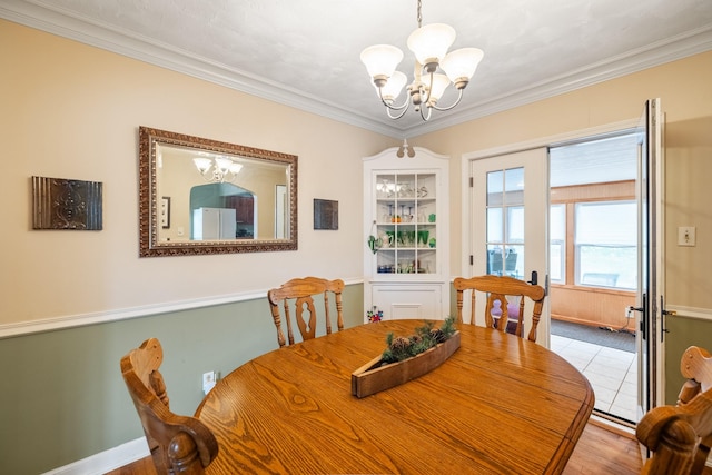 1209 Edgemont St, Des Moines, IA 50315 - dining area with a chandelier, ornamental molding, and wood finished floors