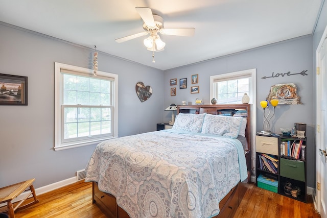 1209 Edgemont St, Des Moines, IA 50315 - bedroom featuring wood finished floors and ceiling fan