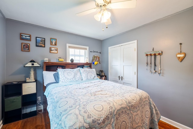 1209 Edgemont St, Des Moines, IA 50315 - bedroom featuring dark wood-style floors, a closet, and a ceiling fan