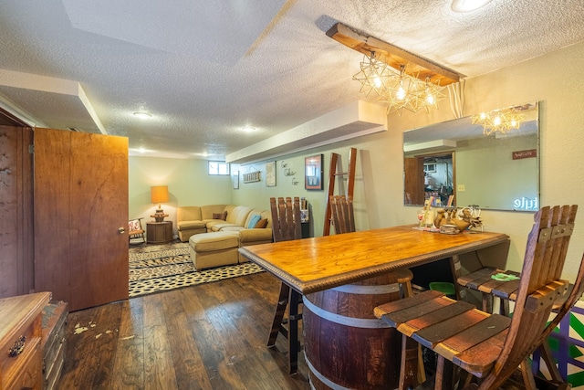 1209 Edgemont St, Des Moines, IA 50315 - dining area with a textured ceiling and hardwood / wood-style floors