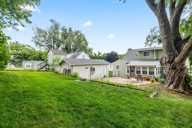 1209 Edgemont St, Des Moines, IA 50315 - rear view of property featuring a patio area
