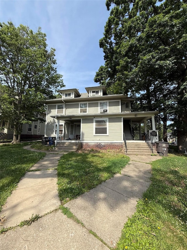 1148 36th St, Des Moines, IA 50311 - traditional style home with a porch and a front yard