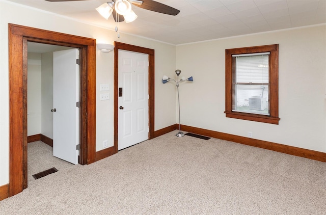 5812 SW 5th St, Des Moines, IA 50315 - spare room featuring ceiling fan, carpet flooring, and crown molding